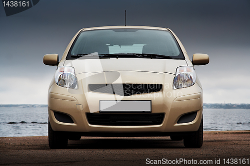 Image of Front view of a beige car