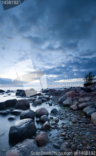 Image of Stones in the sea after sunset