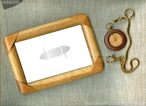 Image of wooden frame with old watch