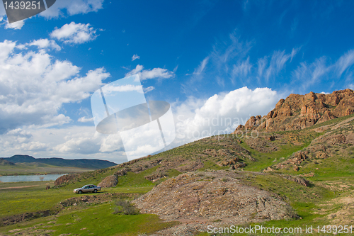 Image of landscape  with crag, rock and cloudy sky