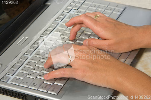 Image of hands over keyboard