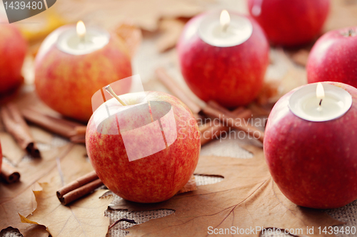 Image of apple as candlestick