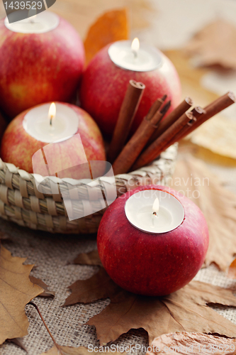 Image of apple as candlestick