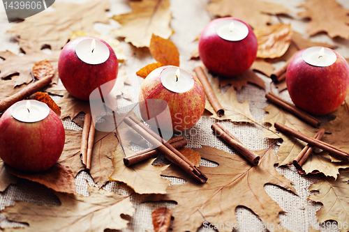Image of apple as candlestick