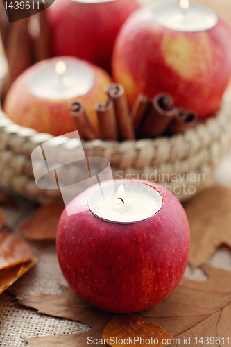 Image of apple as candlestick