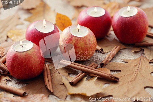 Image of apple as candlestick