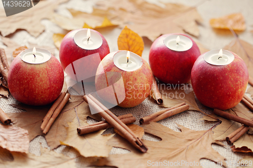 Image of apple as candlestick