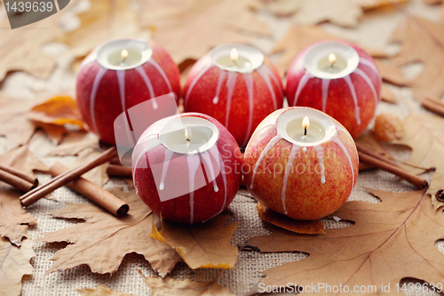 Image of apple as candlestick