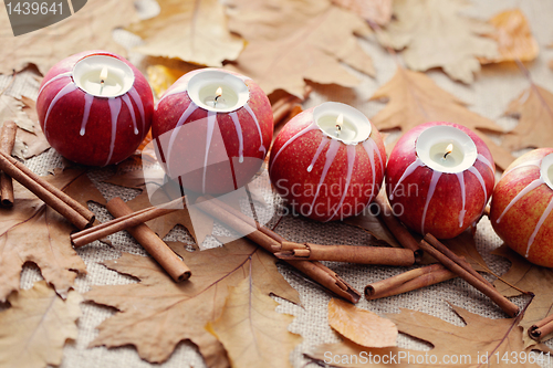 Image of apple as candlestick