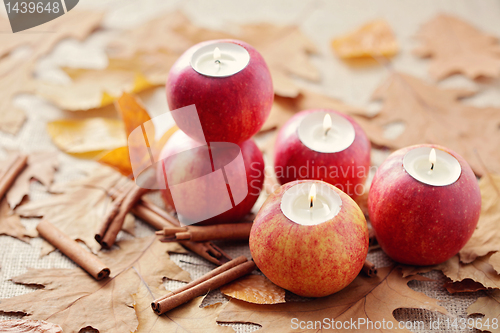 Image of apple as candlestick