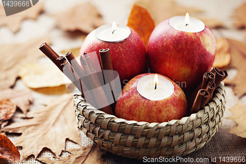 Image of apple as candlestick