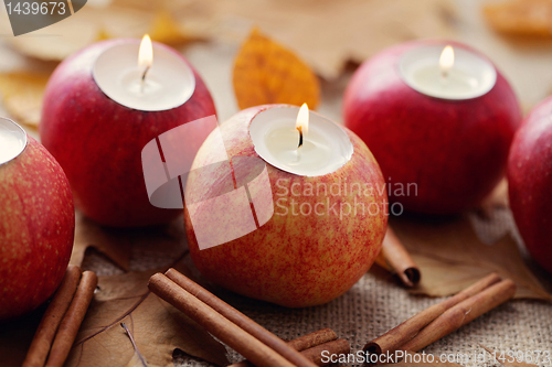 Image of apple as candlestick