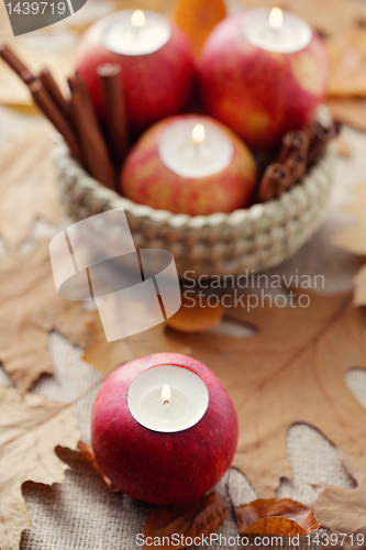 Image of apple as candlestick