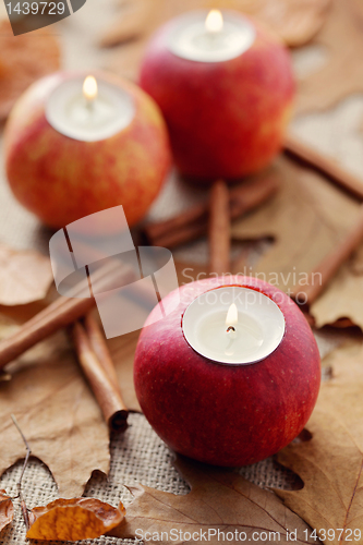 Image of apple as candlestick