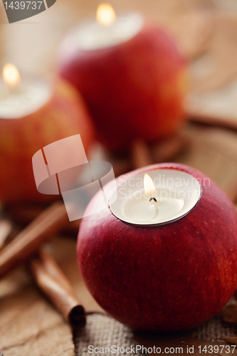 Image of apple as candlestick