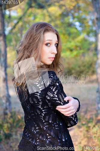 Image of Pretty girl looking back over her shoulder