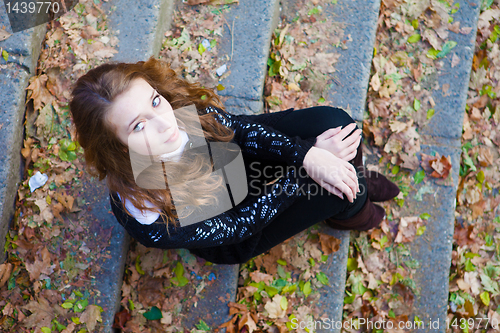 Image of Girl sitting on a steps