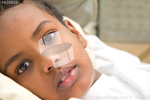 Image of Boy resting in his bed