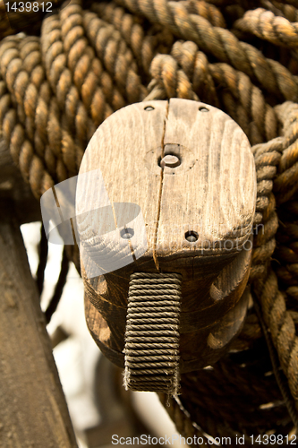 Image of Old rope and wooden block pulleys