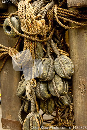 Image of Old rope and wooden block pulleys