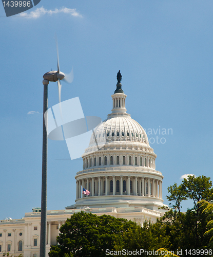 Image of Capitol Building framed by wind turbine