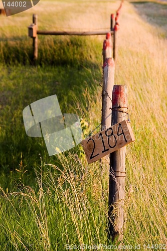 Image of Countryside Fence with Street Number Sign