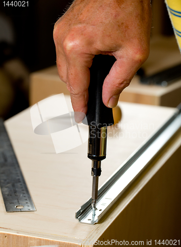 Image of Woodwork tools working on piece of plywood