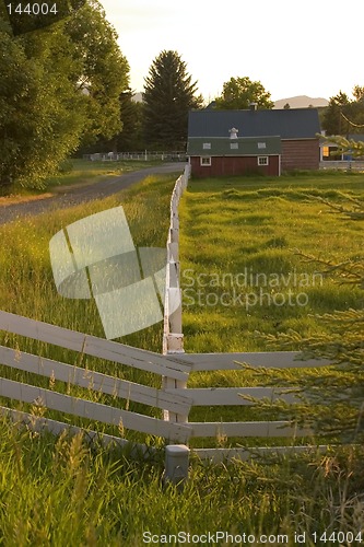 Image of Countryside Fence Leading to A Ranch