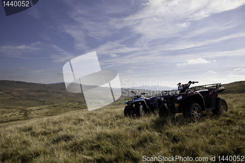 Image of Pair of ATV quad bikes on lonely mountain