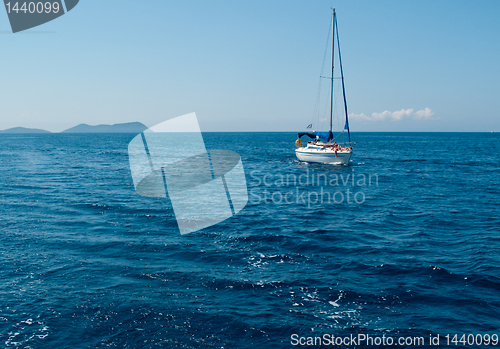 Image of White yacht sailing on calm sea