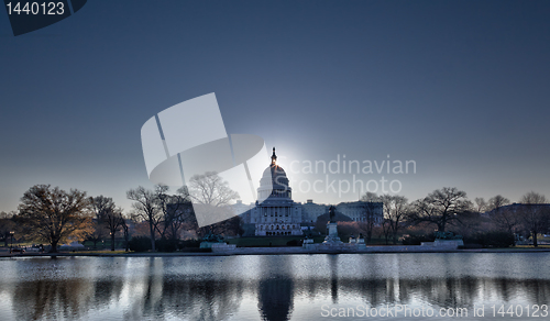Image of Sunrise behind the dome of the Capitol in DC