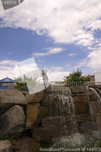 Image of Small Waterfall in a Strip Mall with Blue Skies