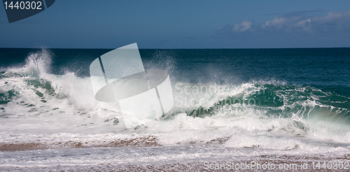 Image of Waves breaking on sandy beach