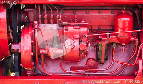 Image of Red engine on old tractor