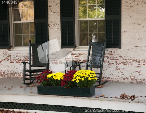 Image of Old rocking chairs on porch