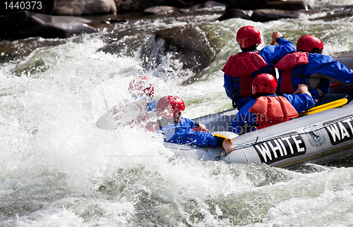 Image of Group in out of control white water raft