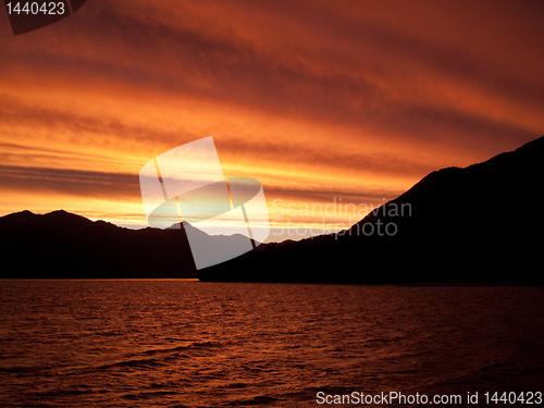 Image of Sunset over water near Queenstown