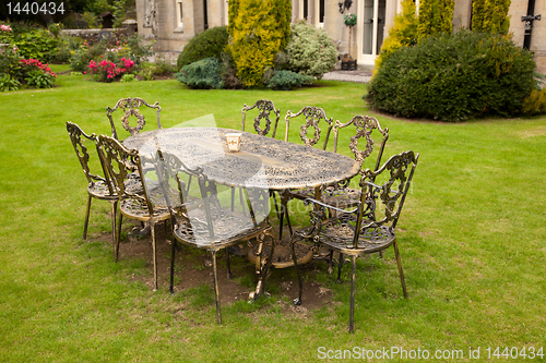 Image of Cast iron table and chairs