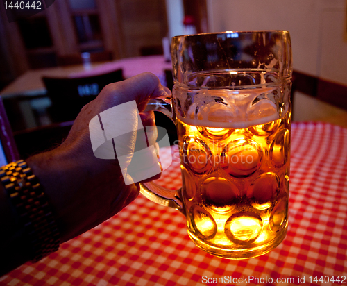 Image of Liter glass of beer in hand