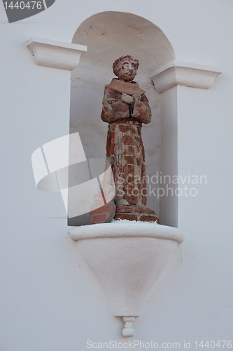 Image of Humorous statue of saint with guitar