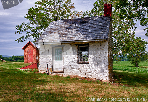 Image of Old white house on farmland