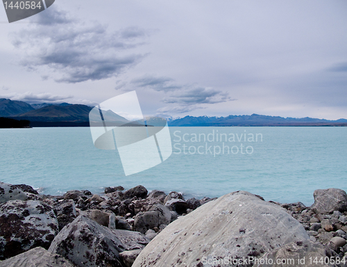 Image of Mount Cook over a blue lake