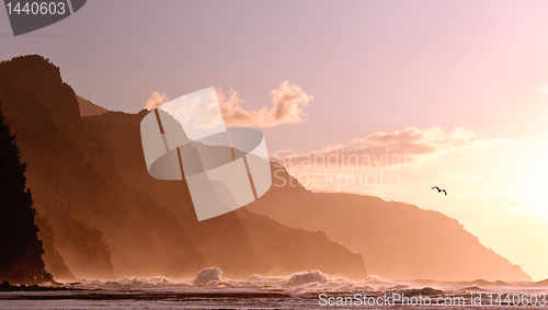 Image of Sunset off the Na Pali coastline on Kauai with a stormy sea