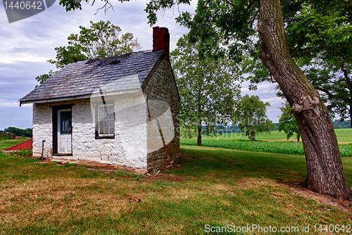 Image of Old white house on farmland