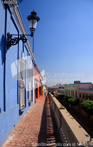 Image of Brightly painted houses on old pathway