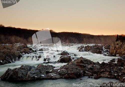 Image of Sun sets behind Great Falls near Washington