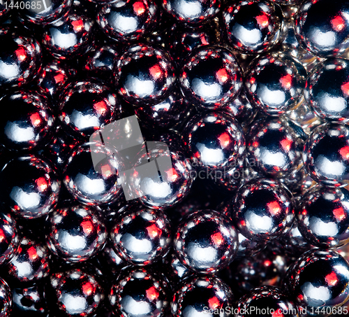 Image of Ball bearings illuminated by color lights
