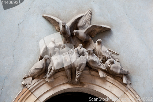 Image of Doves above archway