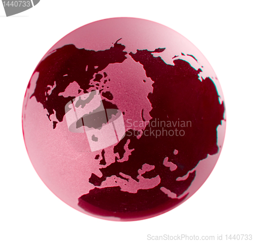 Image of Polar view of a glass earth globe with red coloring