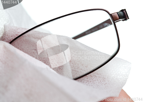 Image of Cleaning glasses with cloth